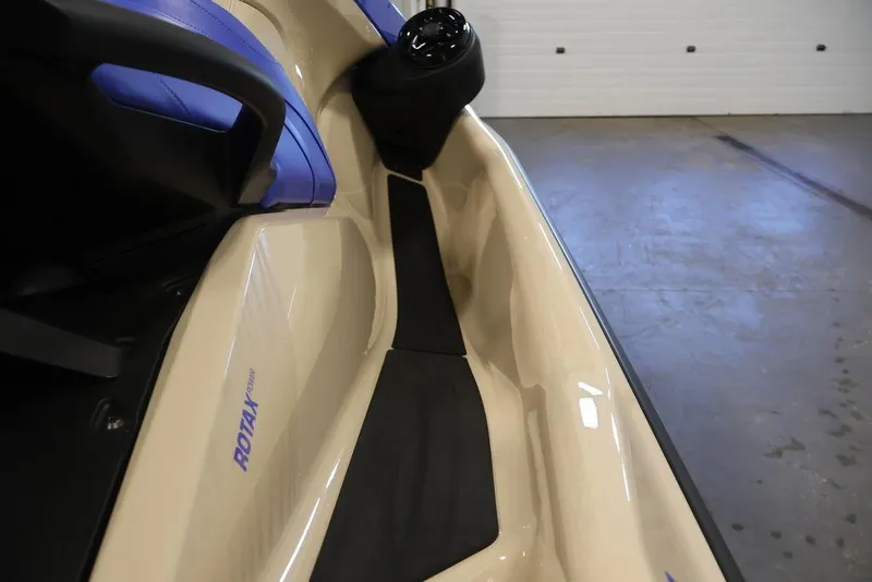Slide: The Image of 2026 Sea-Doo Wake 170 jet ski interior with blue seating and Rotax engine branding. - 13