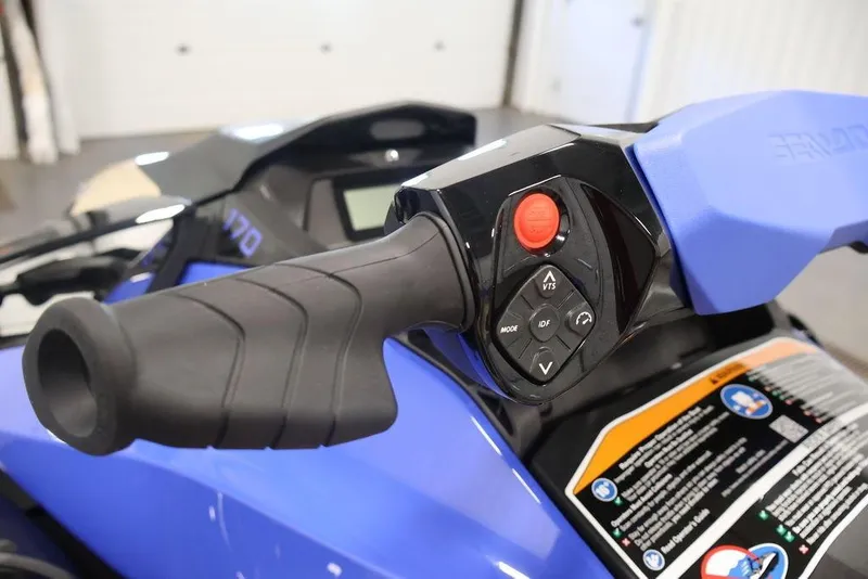 Slide: The Image of Close-up of 2026 Sea-Doo Wake 170 handlebar controls, featuring buttons and grip. - 19