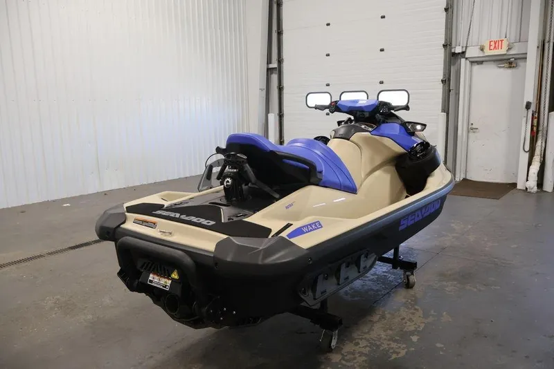 Slide: The Image of 2026 Sea-Doo Wake 170 jet ski in a garage setting, rear view. - 8