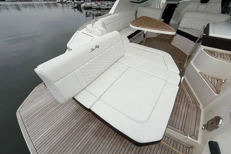 Slide: The Image of 2023 Sea Ray Sundancer 320 Coupe deck with control panel and chrome fittings. - 23