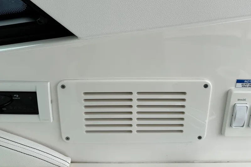 Slide: The Image of 2023 Sea Ray Sundancer 320 Coupe kitchenette with sink, grill, and mini-fridge. - 31