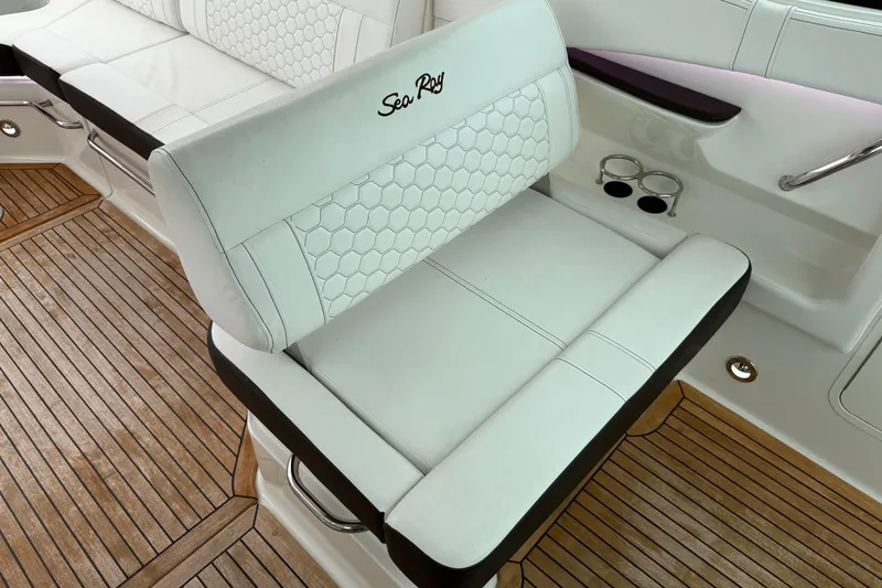 Slide: The Image of 2023 Sea Ray Sundancer 320 Coupe interior panel with vent and control switches. - 32