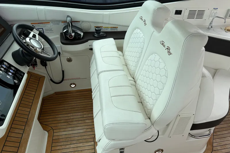 Slide: The Image of Interior view of 2023 Sea Ray Sundancer 320 Coupe overlooking marina. - 39