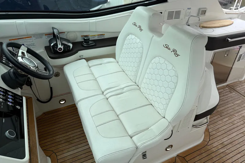 Slide: The Image of 2023 Sea Ray Sundancer 320 Coupe interior with luxurious white seating. - 40