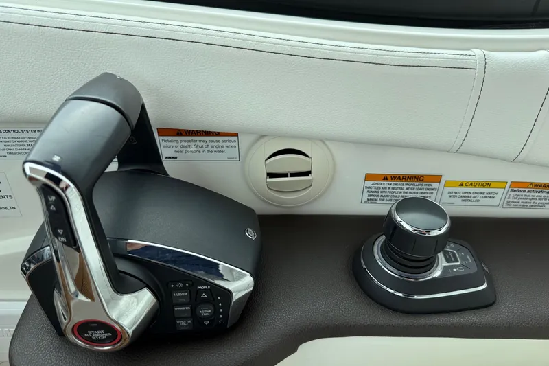 Slide: The Image of 2023 Sea Ray Sundancer 320 Coupe interior with luxurious white seating and wood flooring. - 41