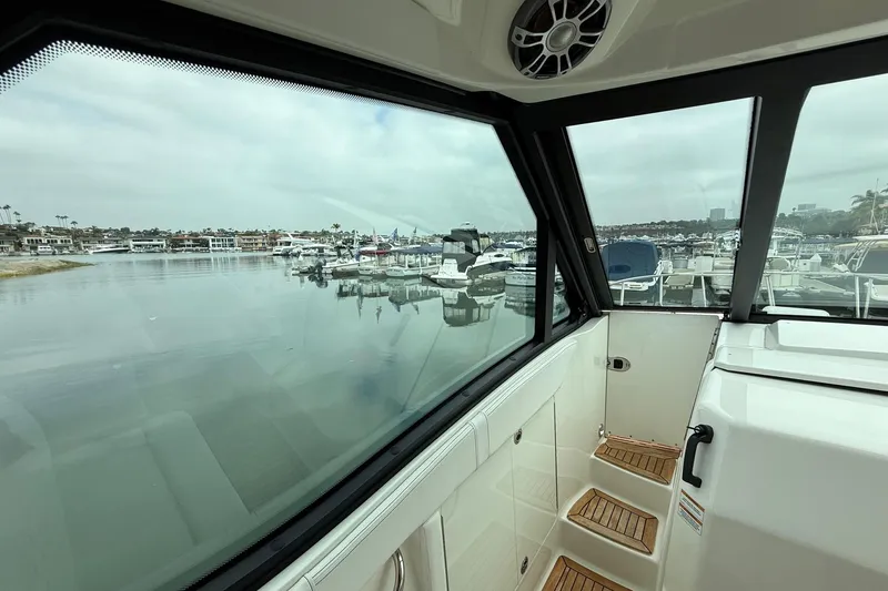 Slide: The Image of 2023 Sea Ray Sundancer 320 Coupe helm with advanced navigation system and luxurious interior. - 44
