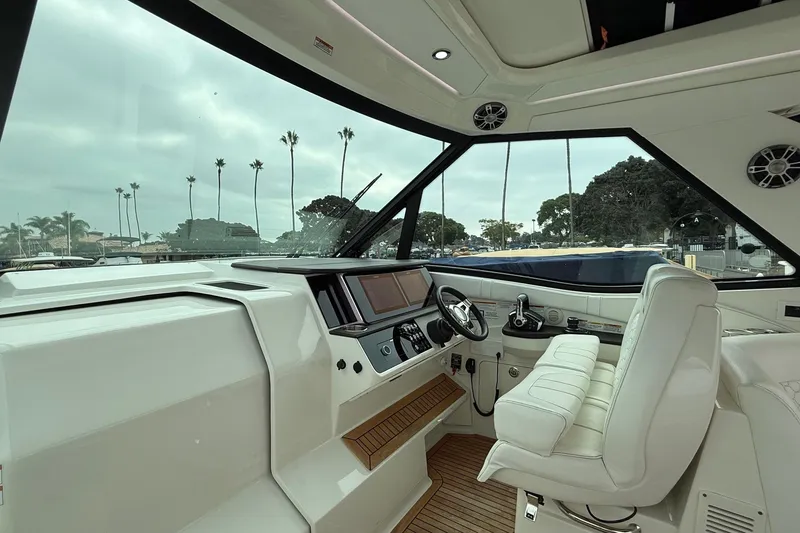 Slide: The Image of 2023 Sea Ray Sundancer 320 Coupe helm with modern navigation and control systems. - 45