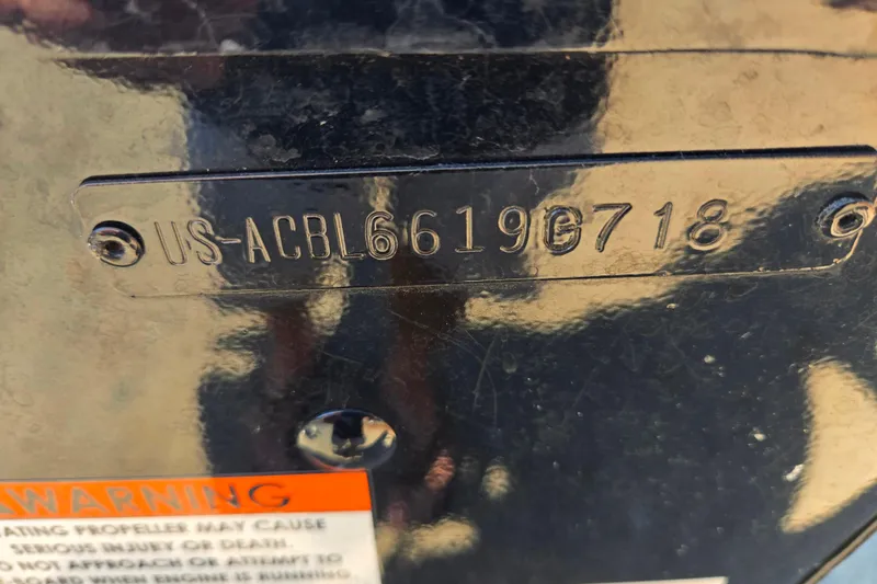 Slide: The Image of 2018 Alumacraft Escape 165 CS boat identification number plate with warning label. - 14