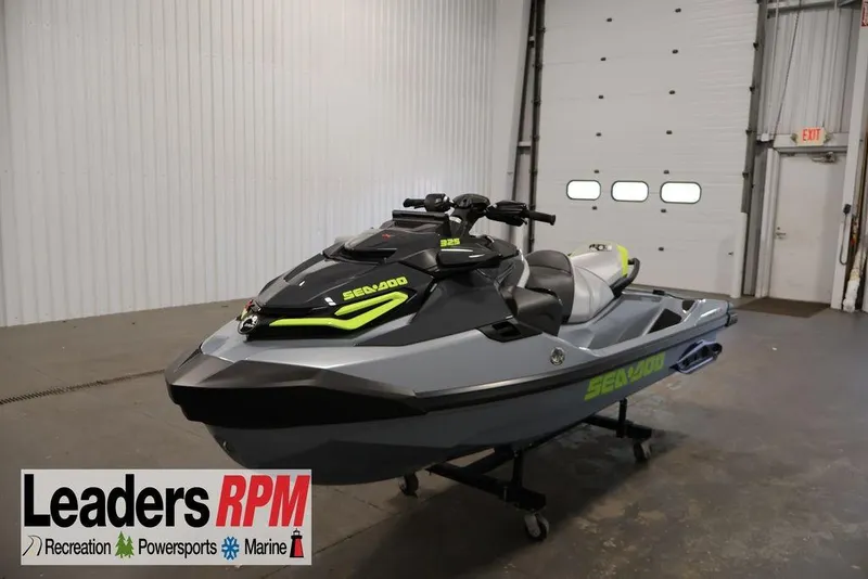 The Image of 2026 Sea-Doo RXT-X 325 jet ski in showroom, featuring sleek design and vibrant accents. - 1