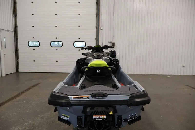 Slide: The Image of 2026 Sea-Doo RXT-X 325 jet ski in a garage, rear view. - 13