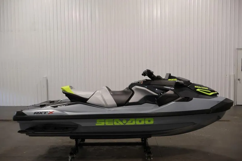 Slide: The Image of 2026 Sea-Doo RXT-X 325 jet ski in a showroom, featuring sleek design and vibrant accents. - 14