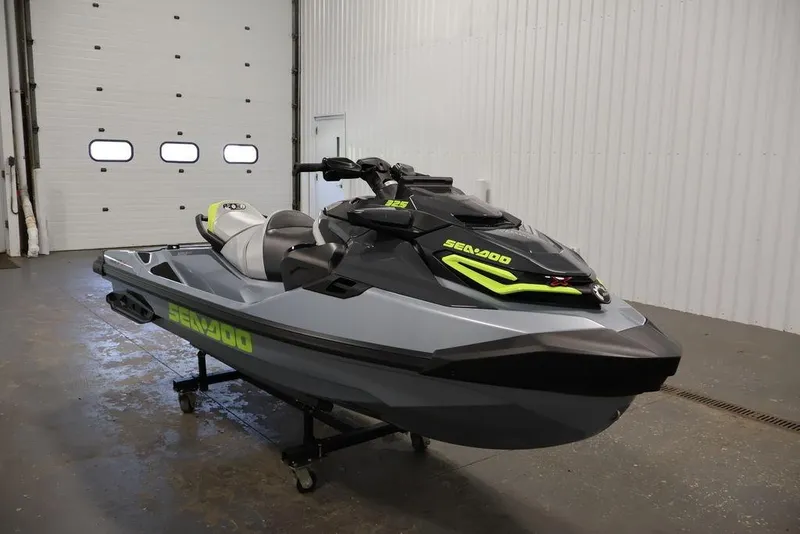 Slide: The Image of 2026 Sea-Doo RXT-X 325 jet ski in a garage, showcasing sleek design and vibrant accents. - 15