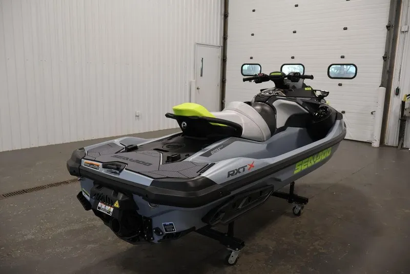 Slide: The Image of 2026 Sea-Doo RXT-X 325 jet ski in a garage setting. - 2