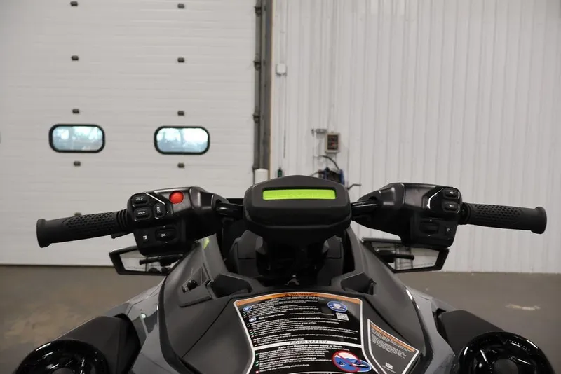 Slide: The Image of 2026 Sea-Doo RXT-X 325 handlebars and dashboard in a garage setting. - 8