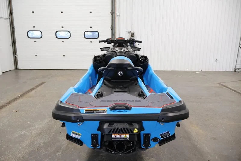 Slide: The Image of 2026 Sea-Doo RXT-X 325 jet ski in a garage, rear view. - 10