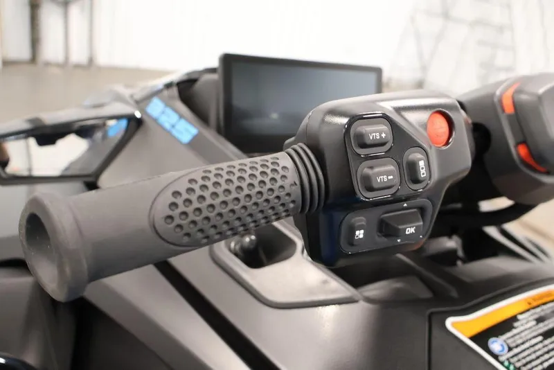 Slide: The Image of Close-up of 2026 Sea-Doo RXT-X 325 handlebar controls and display screen. - 12
