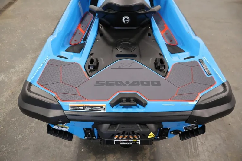 Slide: The Image of 2026 Sea-Doo RXT-X 325, blue watercraft rear view, showcasing deck design and branding. - 20
