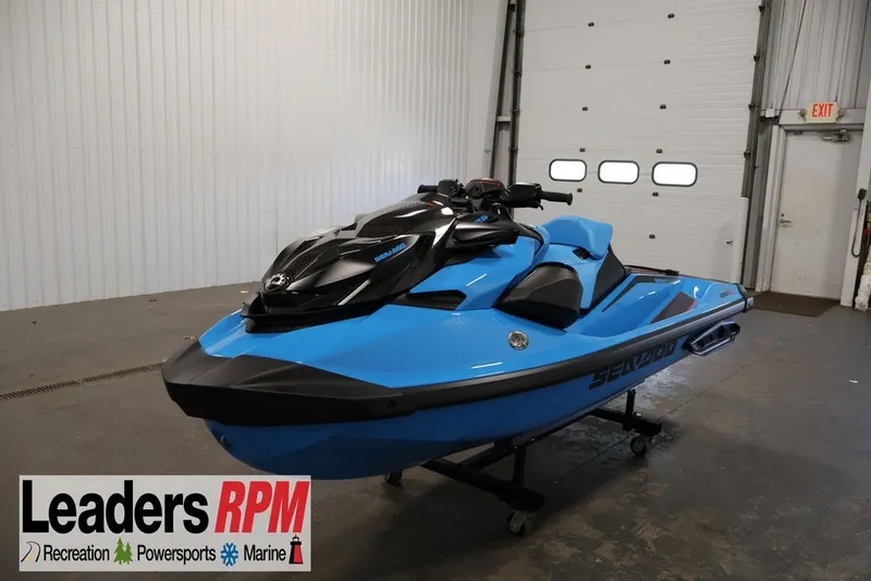 The Image of 2026 Sea-Doo RXP-X 325 jet ski in blue, displayed indoors at Leaders RPM. - 3