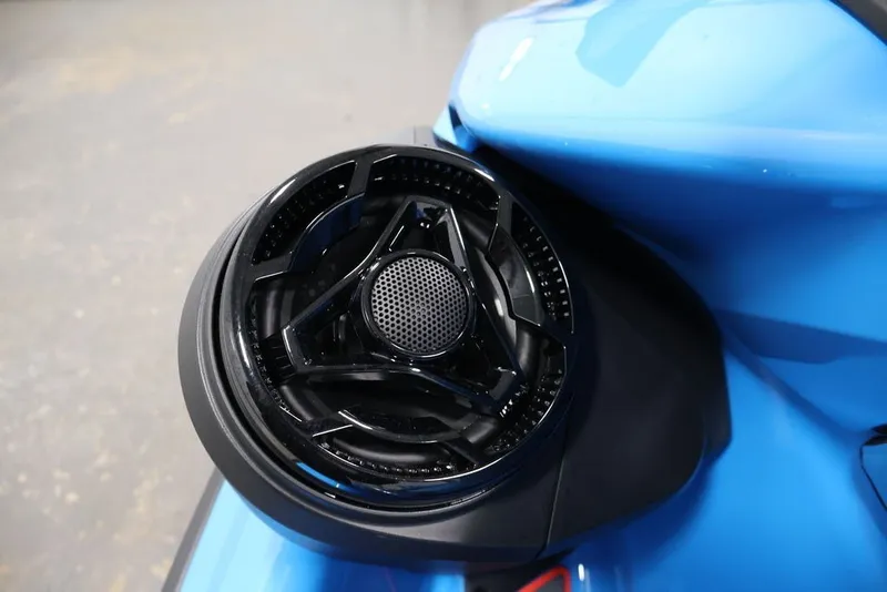 Slide: The Image of Close-up of 2026 Sea-Doo RXP-X 325 speaker on blue body. - 23