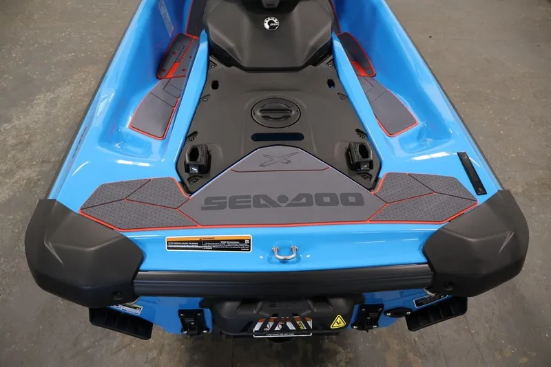 Slide: The Image of 2026 Sea-Doo RXP-X 325 in blue, showcasing rear deck and branding details. - 19
