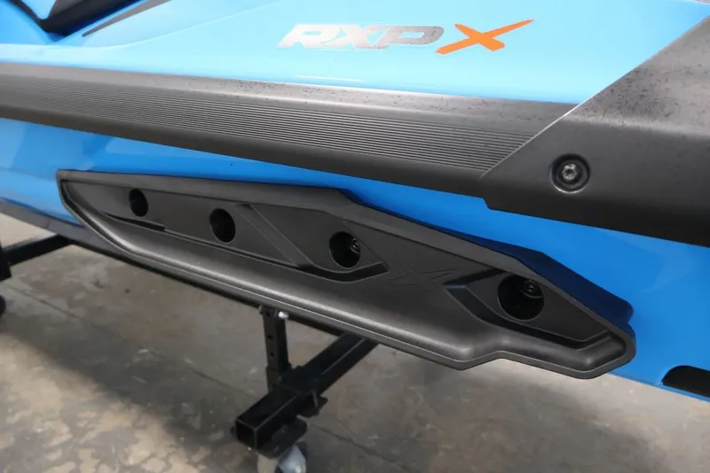 Slide: The Image of 2026 Sea-Doo RXP-X 325, close-up of blue and black body detailing. - 22