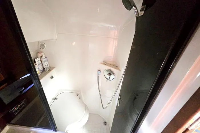 Slide: The Image of 2014 Four Winns V375 yacht enclosed head with shower and toilet. - 11