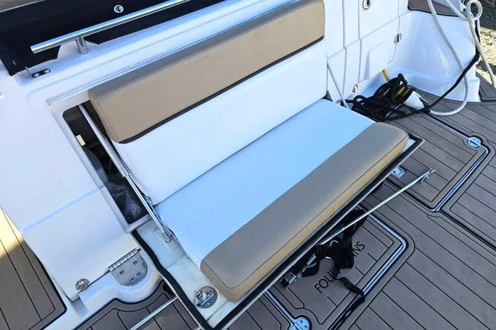 Slide: The Image of 2014 Four Winns V375 boat with foldable seating on deck. - 17