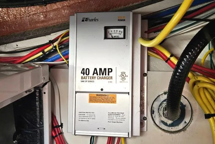 Slide: The Image of 40 AMP battery charger in 2014 Four Winns V375 boat, surrounded by colorful wiring. - 26