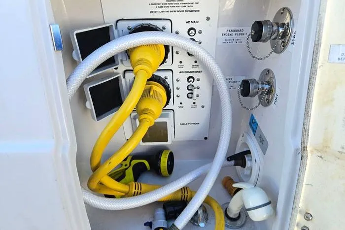 Slide: The Image of Electrical and plumbing connections on a 2014 Four Winns V375 boat. - 31