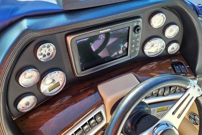 Slide: The Image of Dashboard of 2014 Four Winns V375 boat with gauges and navigation system. - 5