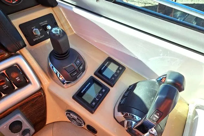 Slide: The Image of Control panel of 2014 Four Winns V375 boat with joystick and throttle controls. - 6