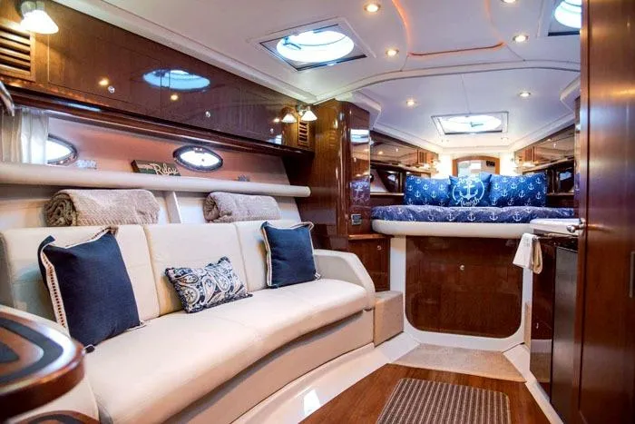 Slide: The Image of Luxurious interior of 2014 Four Winns V375 yacht with elegant seating and bedding. - 8
