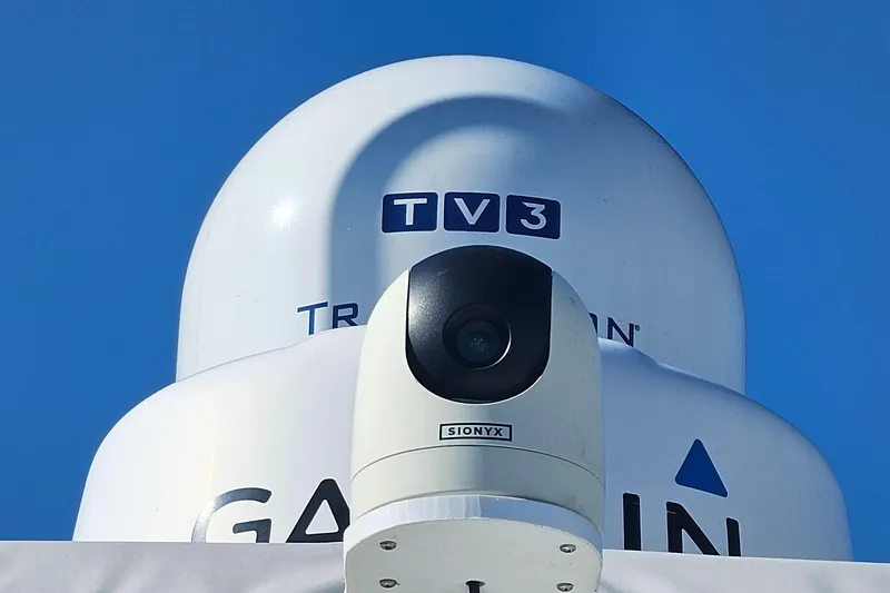 Slide: The Image of Radar and camera equipment on a 2004 Luhrs 34 Convertible boat against a clear blue sky. - 26