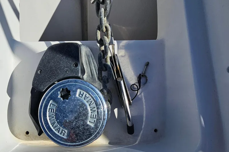 Slide: The Image of Anchor windlass on 2004 Luhrs 34 Convertible boat deck. - 28
