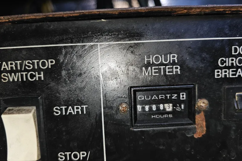 Slide: The Image of Control panel of 2004 Luhrs 34 Convertible boat with hour meter reading 809.9 hours. - 49