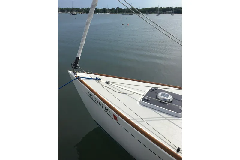Slide: The Image of Sailboat Alerion Express 28, 1995 model, docked on calm water. - 5