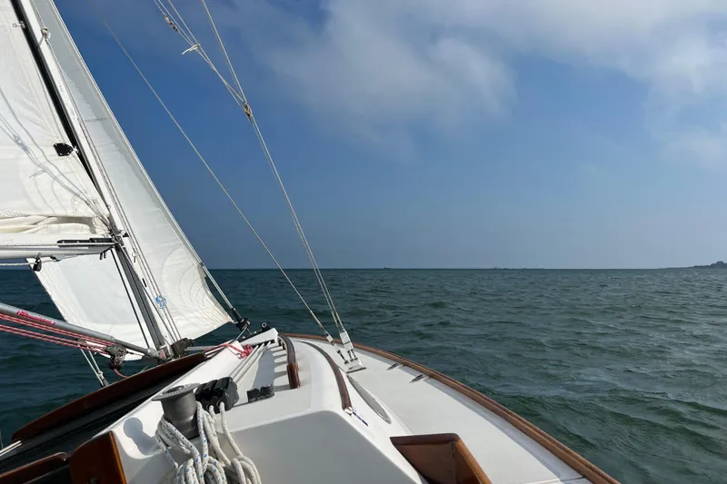 Slide: The Image of Sailing on a 1995 Alerion Express 28 under clear blue skies. - 7