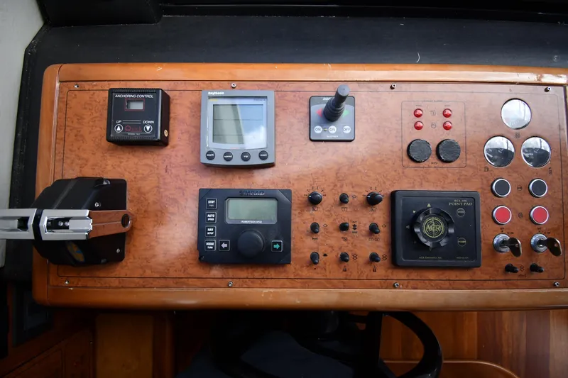 Slide: The Image of Control panel of a 2001 Ferretti Yachts 72, featuring navigation and anchoring systems. - 103