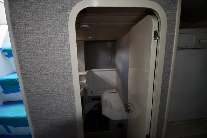 Slide: The Image of Interior view of a 2001 Ferretti Yachts 72, featuring a compact cabin space. - 109