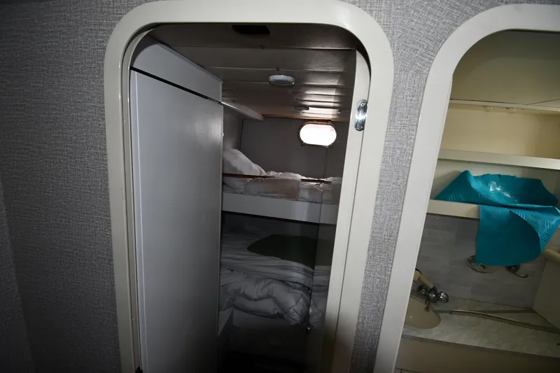 Slide: The Image of Interior cabin of 2001 Ferretti Yachts 72, featuring bunk beds and compact design. - 116