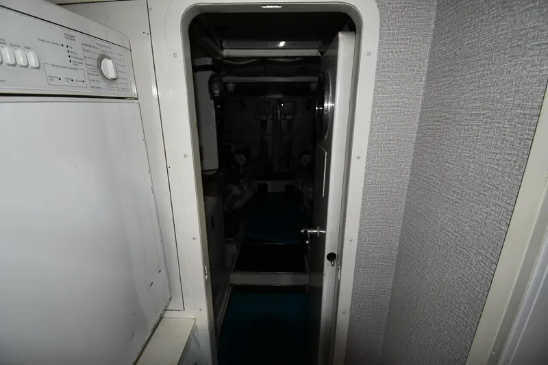 Slide: The Image of Engine room entrance of 2001 Ferretti Yachts 72, featuring a visible control panel. - 118