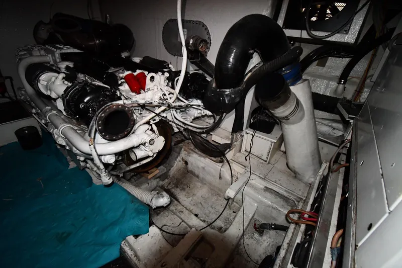 Slide: The Image of Engine room of a 2001 Ferretti Yachts 72, showcasing mechanical components. - 123