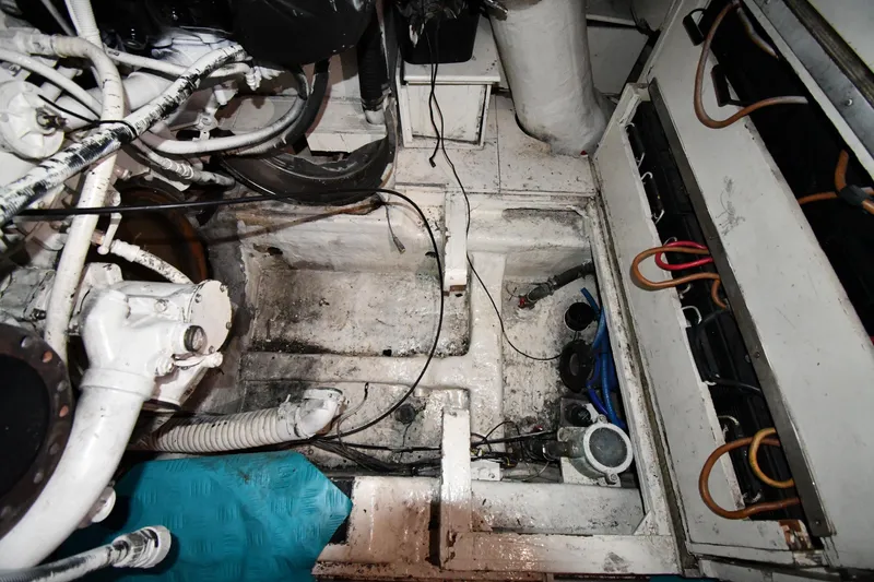 Slide: The Image of Engine room of a 2001 Ferretti Yachts 72, showcasing mechanical components and wiring. - 126
