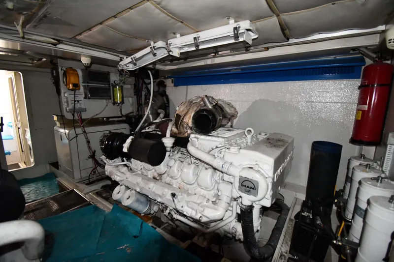 Slide: The Image of Engine room of a 2001 Ferretti Yachts 72, featuring a MAN engine. - 127
