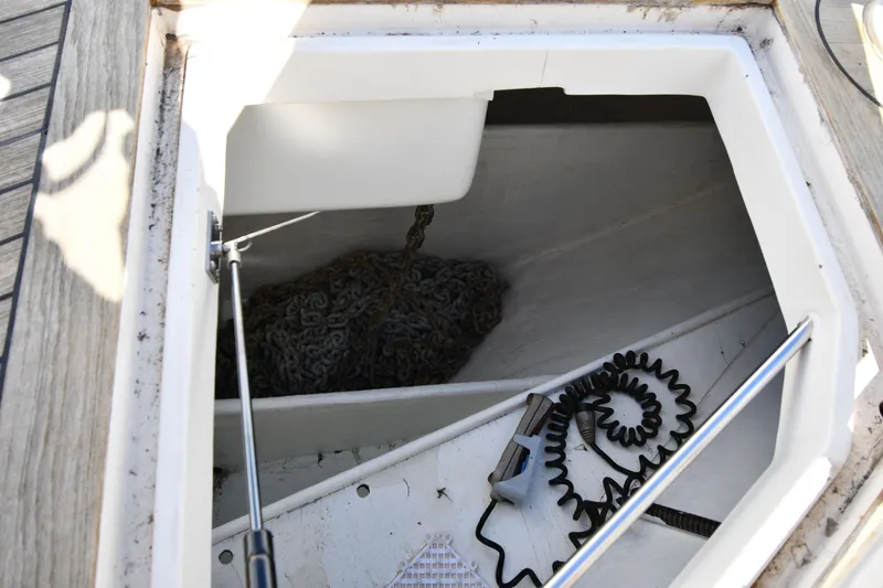 Slide: The Image of Anchor chain compartment on a 2001 Ferretti Yachts 72, featuring coiled cable and equipment. - 18
