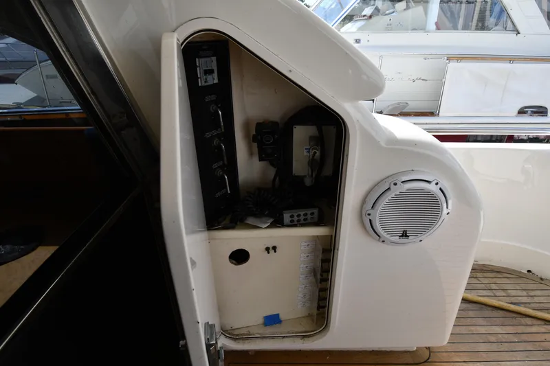 Slide: The Image of Control panel on a 2001 Ferretti Yachts 72, featuring communication equipment and speaker. - 26