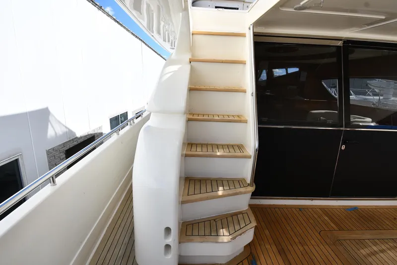 Slide: The Image of Staircase on 2001 Ferretti Yachts 72, featuring teak steps and sleek design. - 27