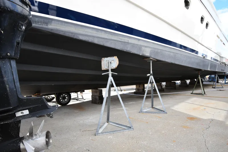 Slide: The Image of 2001 Ferretti Yachts 72 on stands for maintenance, showcasing hull and propeller. - 3