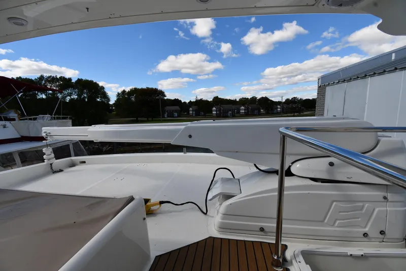 Slide: The Image of Deck view of 2001 Ferretti Yachts 72 under a partly cloudy sky. - 30