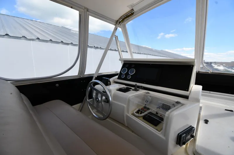 Slide: The Image of Helm of 2001 Ferretti Yachts 72 with steering wheel and control panel. - 33